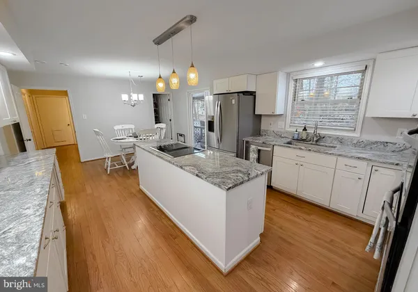 a kitchen with a sink cabinets and window