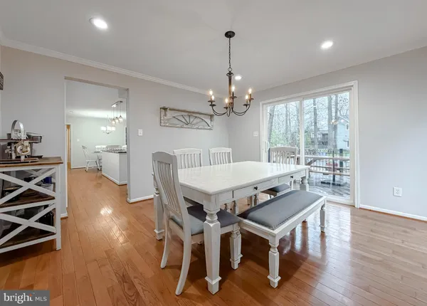 a view of a hallway with wooden floor and entryway