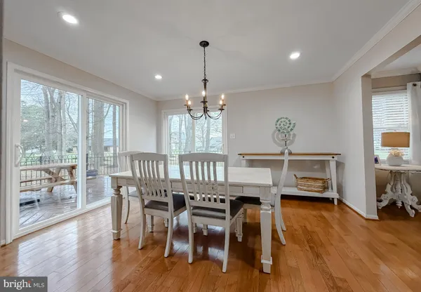 a living room with furniture and a ceiling fan
