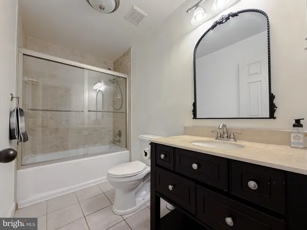 a living room with a fireplace and a flat screen tv