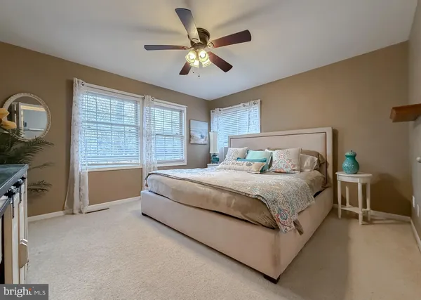 a bedroom with a large bed and a flat screen tv
