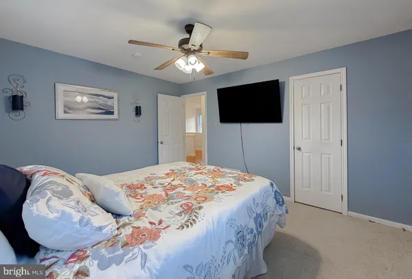 a view of a house with swimming pool and sitting area