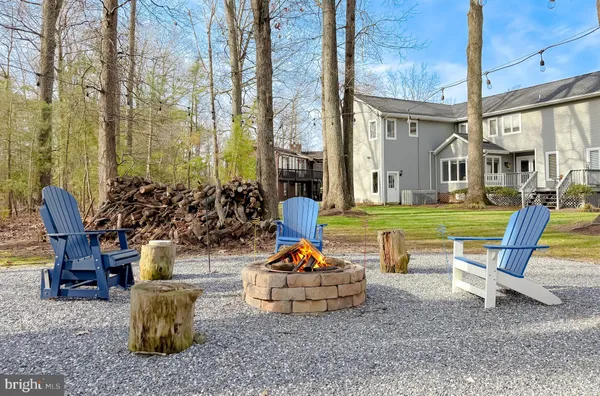 a play bench sitting in the middle of a yard