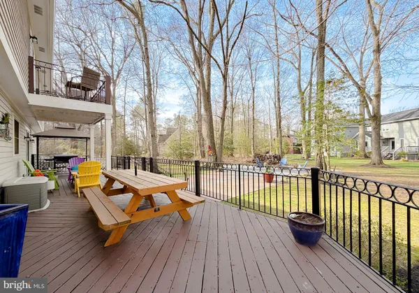 a sitting area with furniture and wooden floor