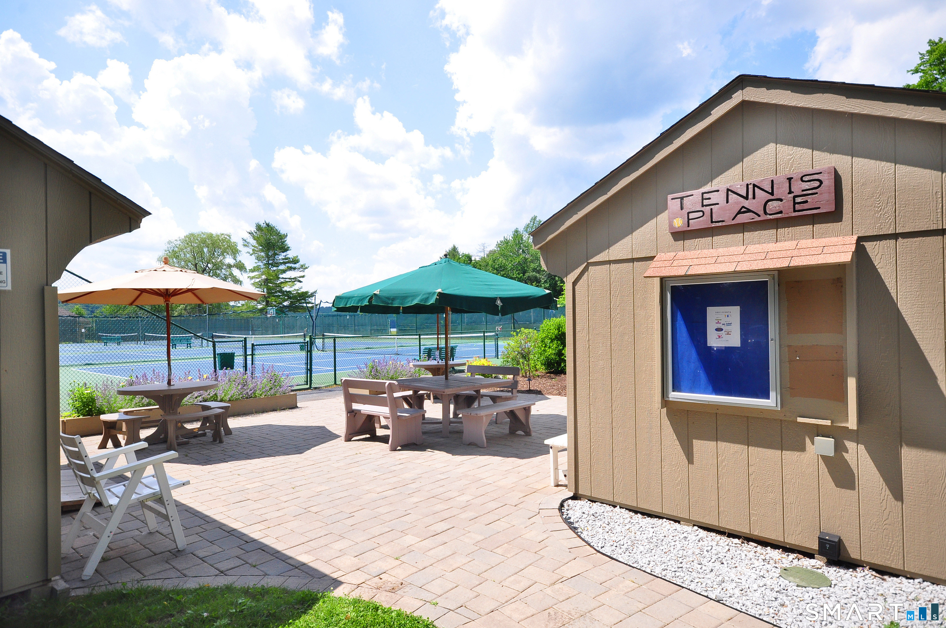 Ashley Drive Goshen, CT 06756 - Photo 16 of 22 a view of a dinning table and chairs in patio