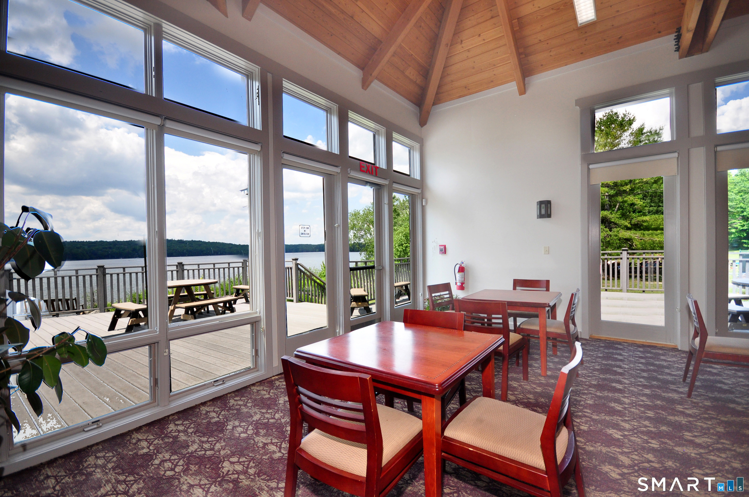 Ashley Drive Goshen, CT 06756 - Photo 21 of 22 a dining room with furniture a chandelier and wooden floor