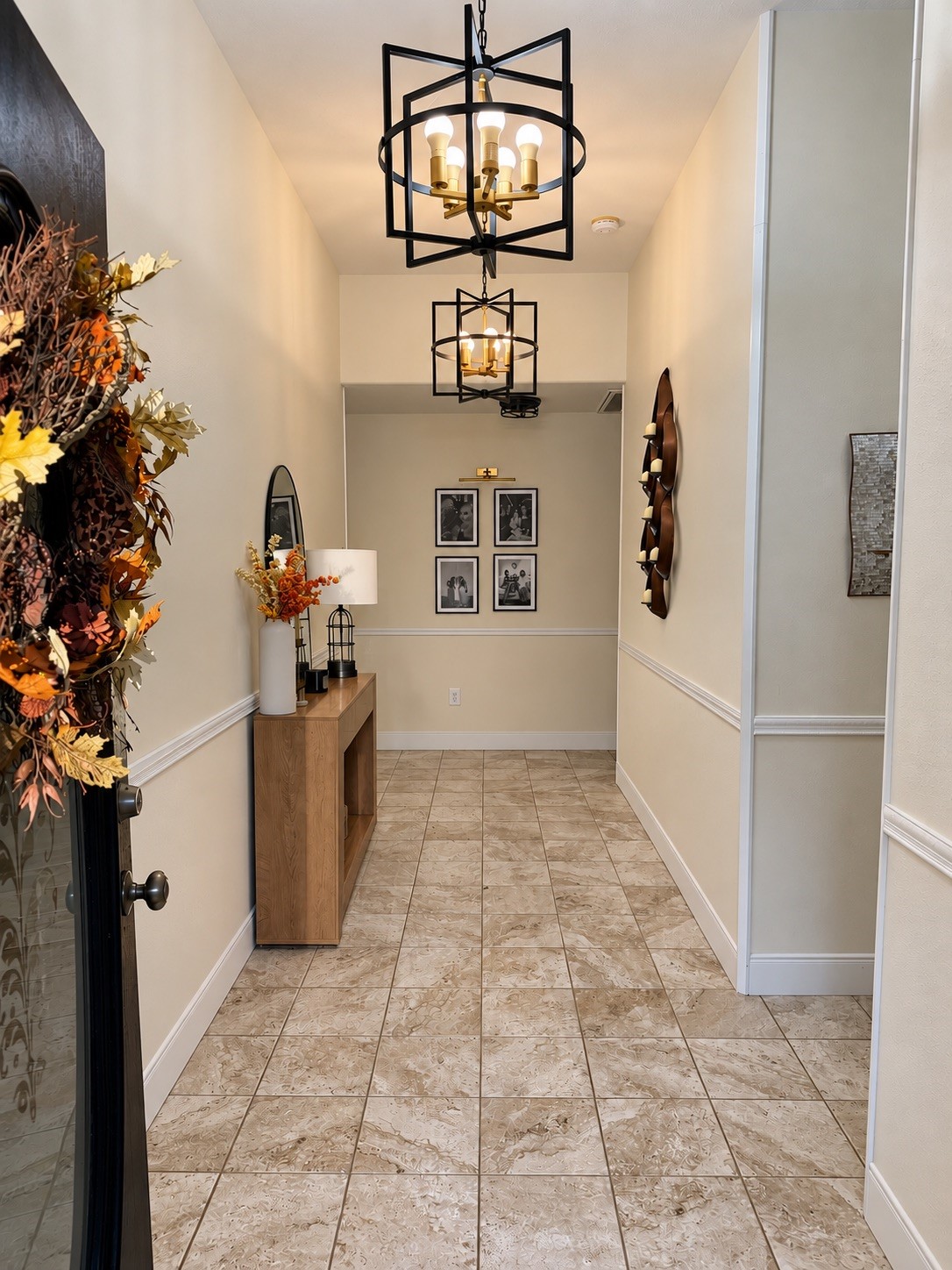 1114 Wagon Road Simonton, TX 77485 - Photo 23 of 48 Inviting entryway with elegant lighting, and warm tile flooring creating a welcoming atmosphere.