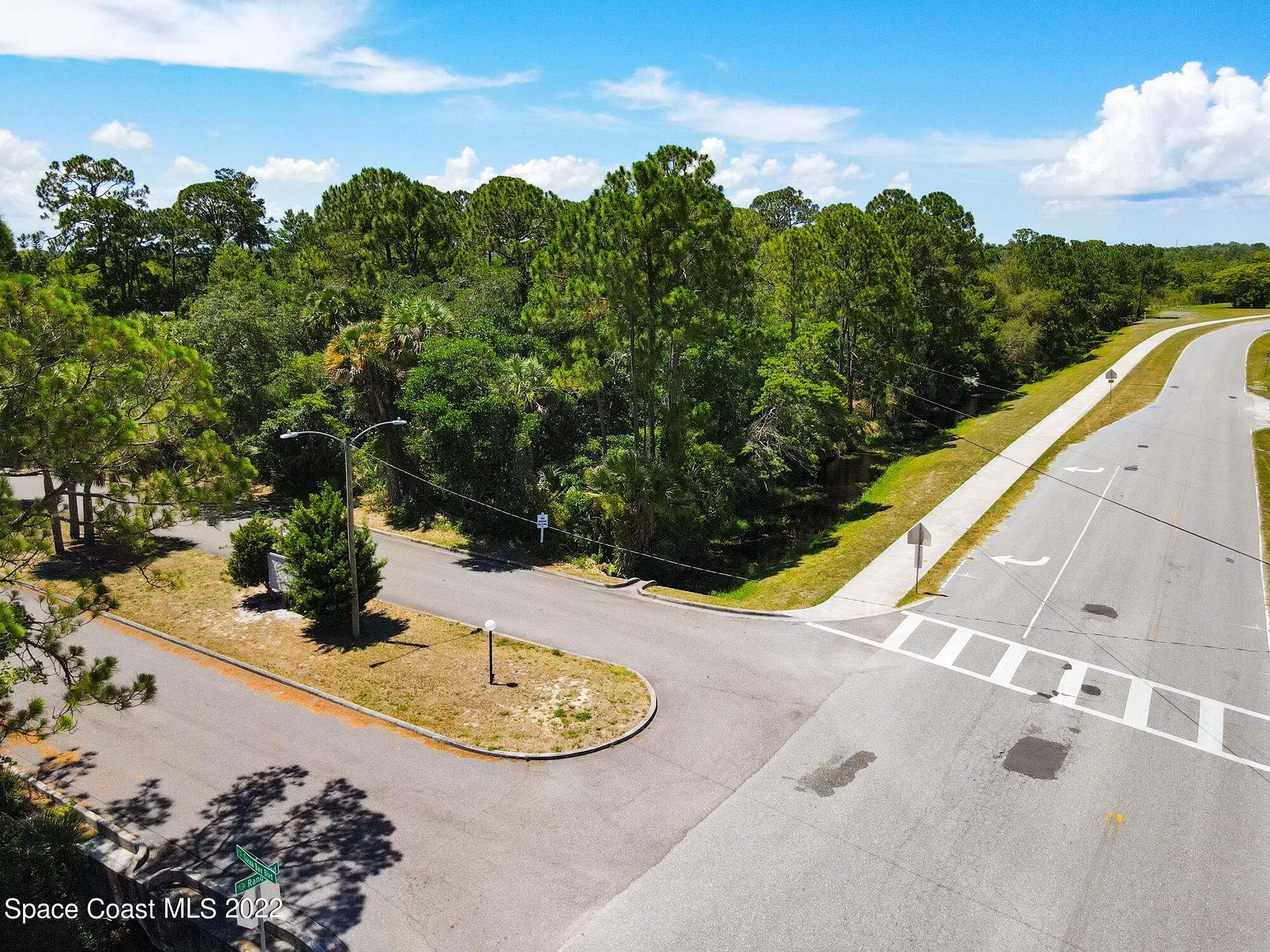 0 North Range Road Cocoa, FL 32926 - Photo 11 of 24 a view of a swimming pool with a yard