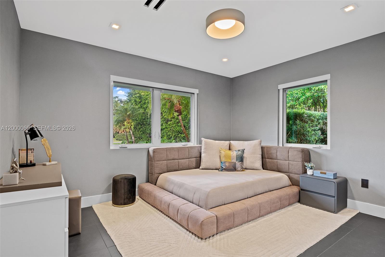 4800 Bay Point Road Miami, FL 33137 - Photo 14 of 74 a bedroom with a large bed and a window