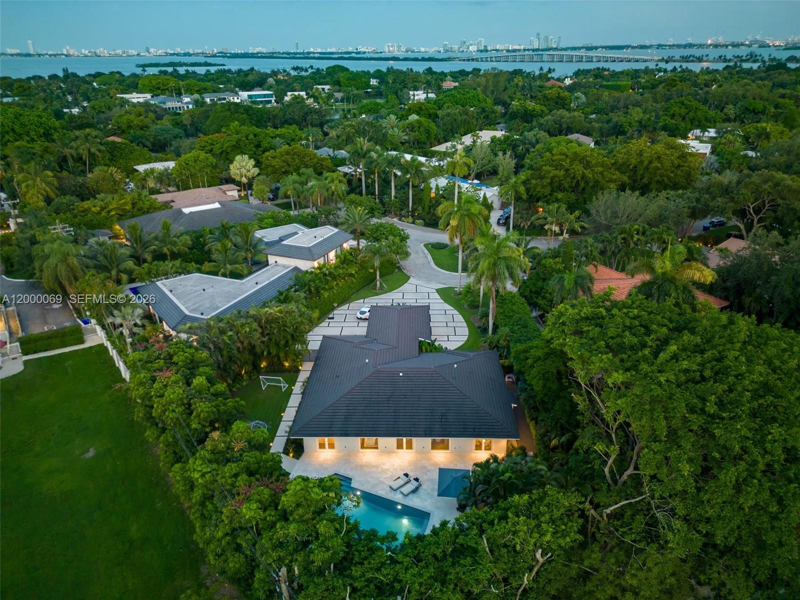 4800 Bay Point Road Miami, FL 33137 - Photo 3 of 74 an aerial view of a house with garden space and street view