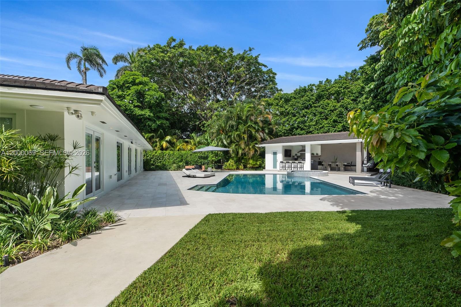 4800 Bay Point Road Miami, FL 33137 - Photo 53 of 74 a front view of a house with a yard