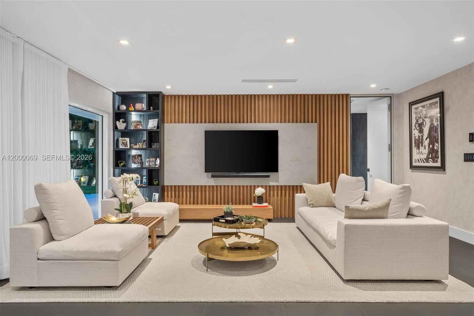 4800 Bay Point Road Miami, FL 33137 - Photo 63 of 74 a living room with furniture and a flat screen tv