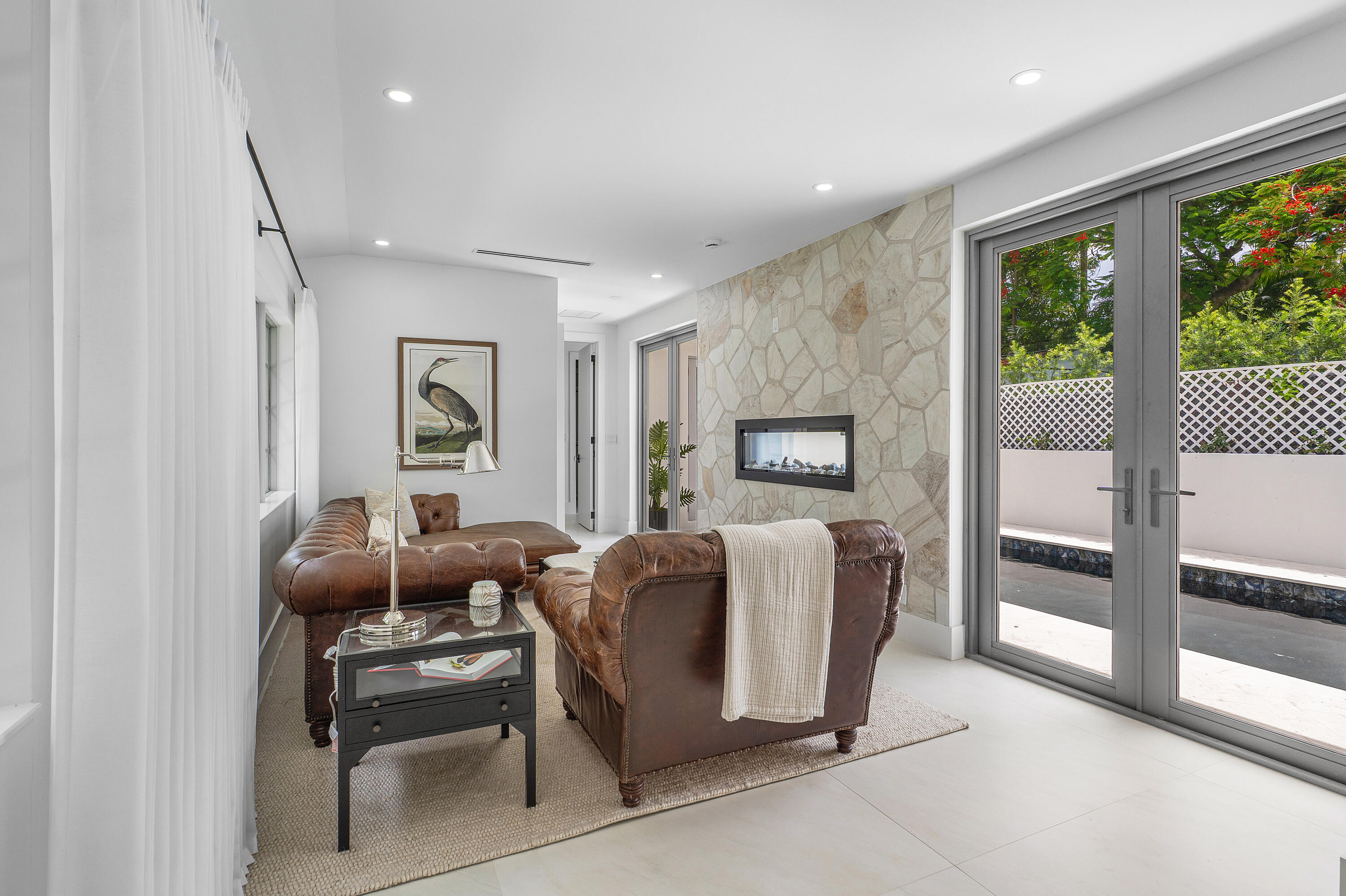 2330 Lake Avenue, Unit 2330 West Palm Beach, FL 33401 - Photo 16 of 44 a living room with furniture a flat screen tv and a window