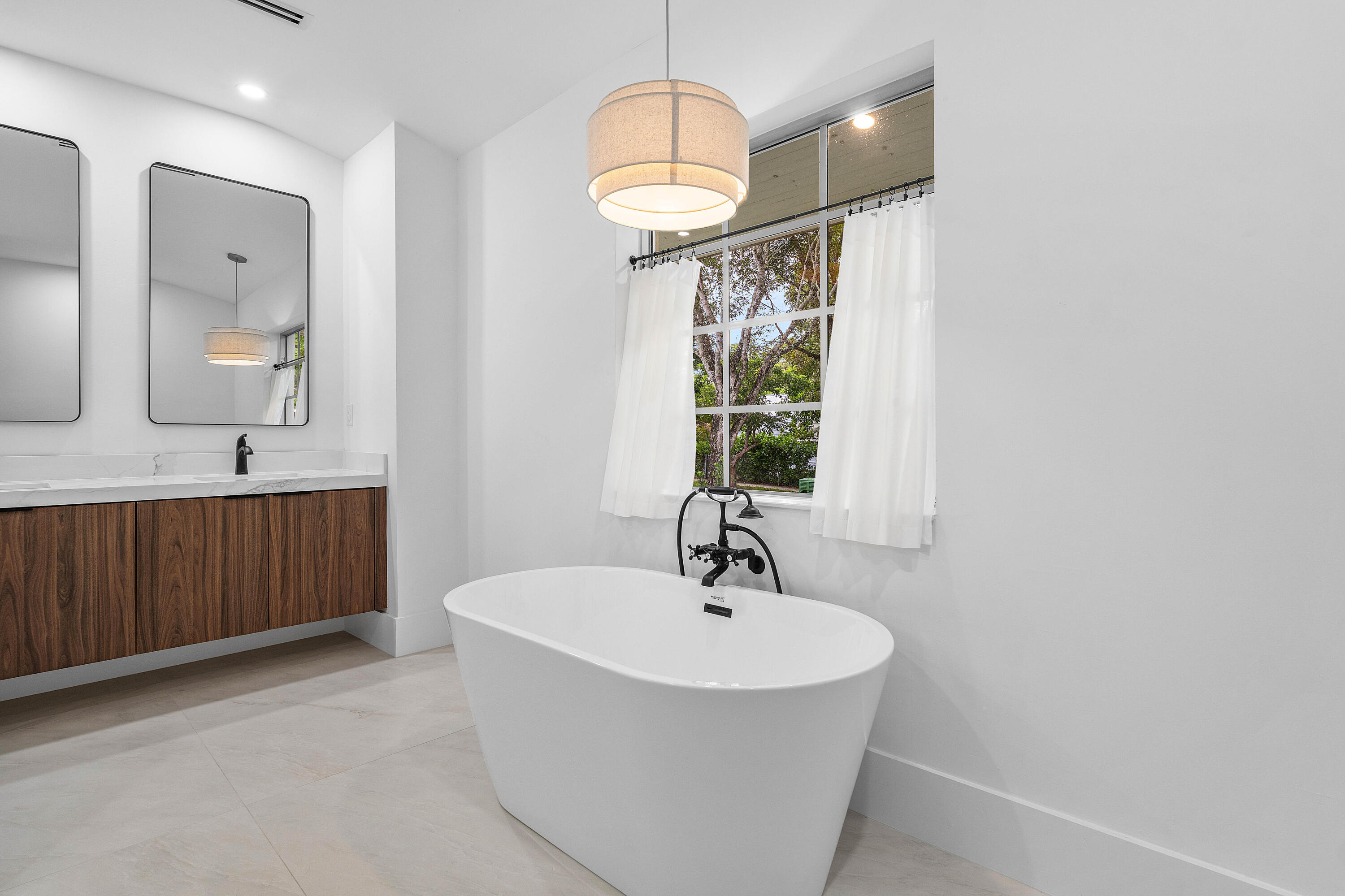 2330 Lake Avenue, Unit 2330 West Palm Beach, FL 33401 - Photo 23 of 44 a bathroom with a sink and a mirror