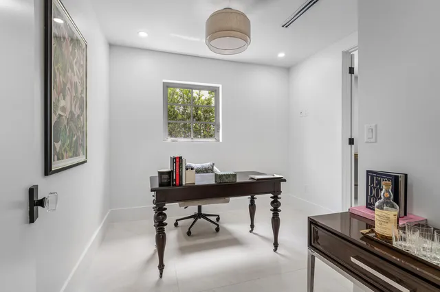 a view of a workspace with furniture