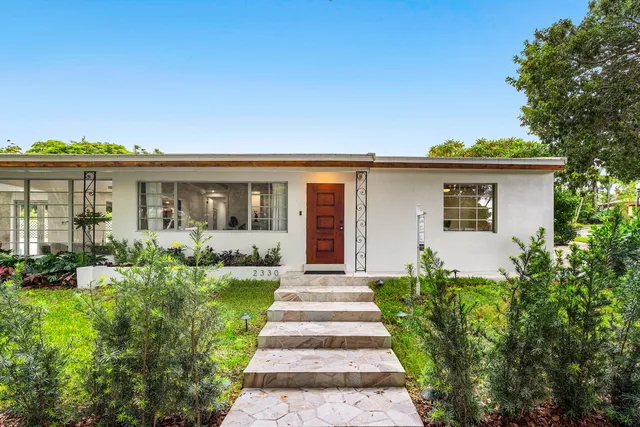 front view of a house with a yard