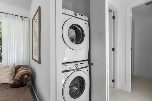 a view of a bedroom with washer and dryer