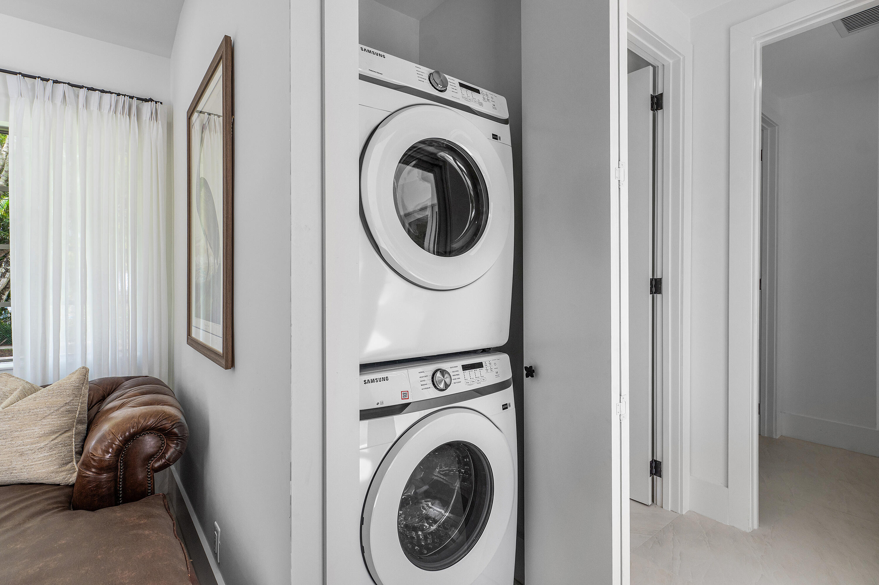 2330 Lake Avenue, Unit 2330 West Palm Beach, FL 33401 - Photo 33 of 44 a view of a bedroom with washer and dryer