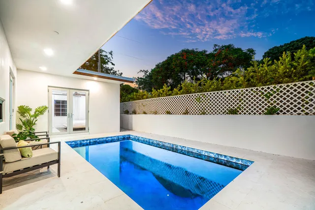 a view of a living room and floor to ceiling window