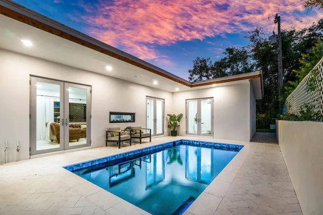 a view of swimming pool with outdoor seating