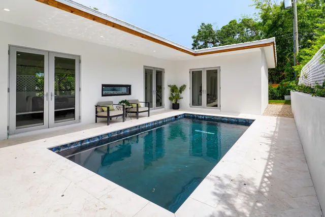 a view of a kitchen with a tub and couches in the patio