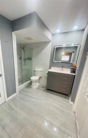 a living room with a couch and a floor to ceiling window