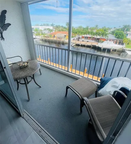 a view of a balcony with chairs