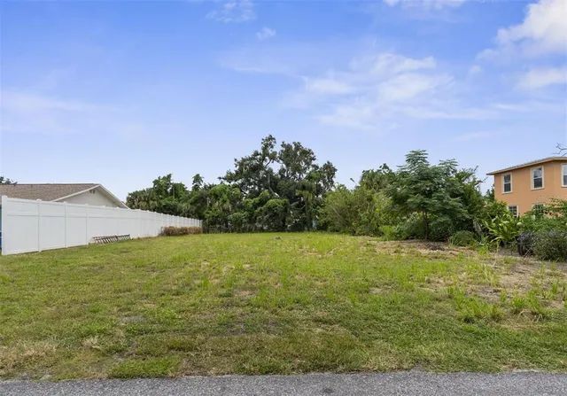 a view of a field with an ocean