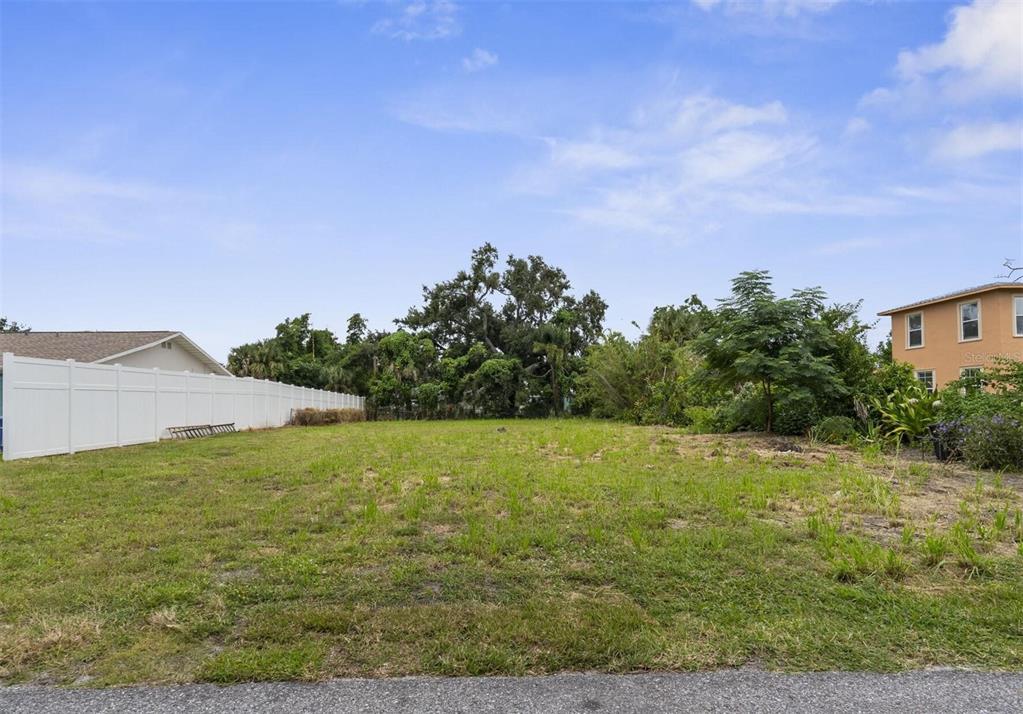 a view of a field with an ocean