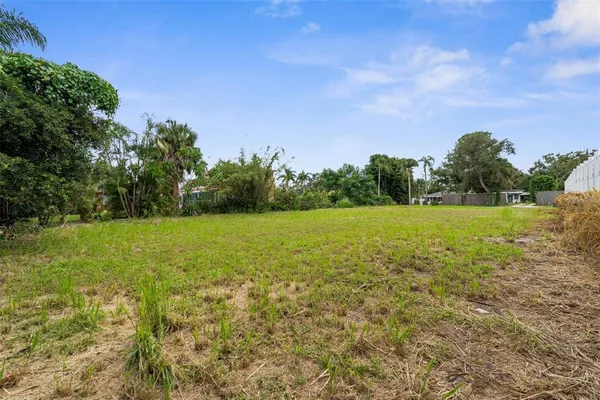 a view of a lake with a yard