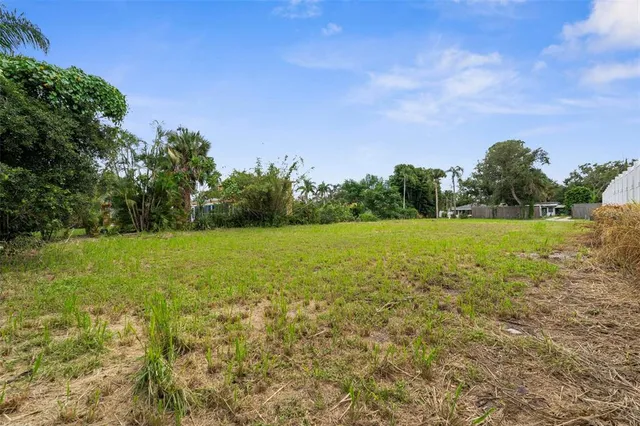 a view of a lake with a yard