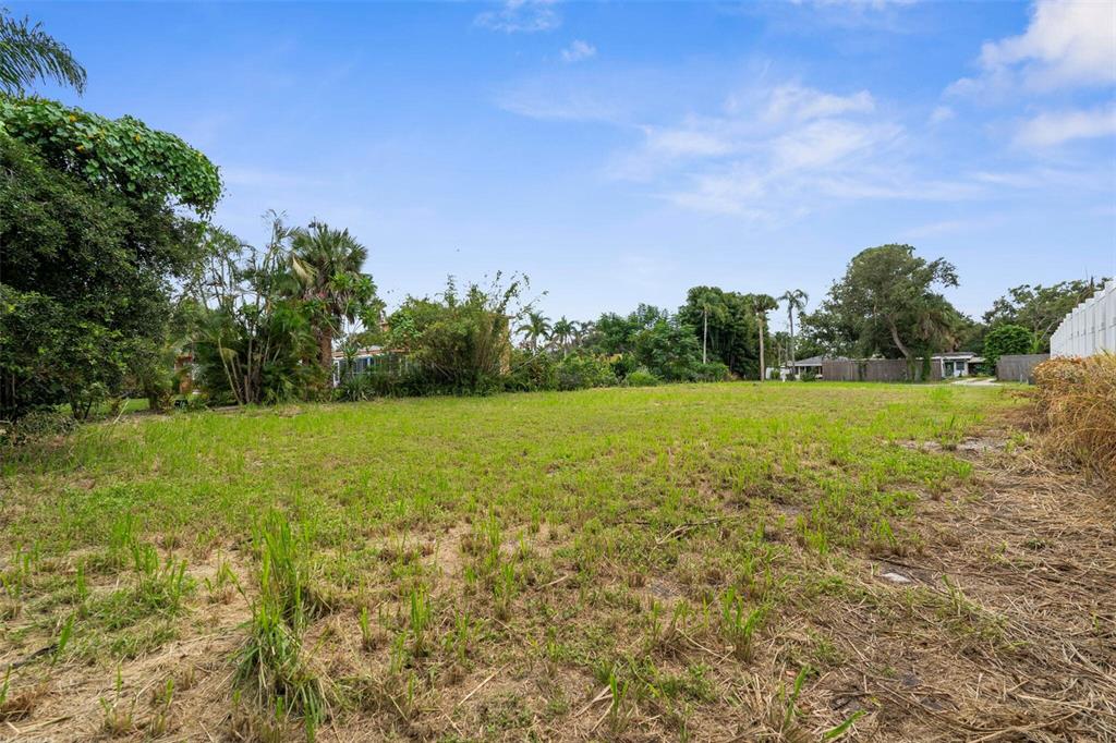 216 Pavonia Road Nokomis, FL 34275 - Photo 11 of 12 a view of a lake with a yard