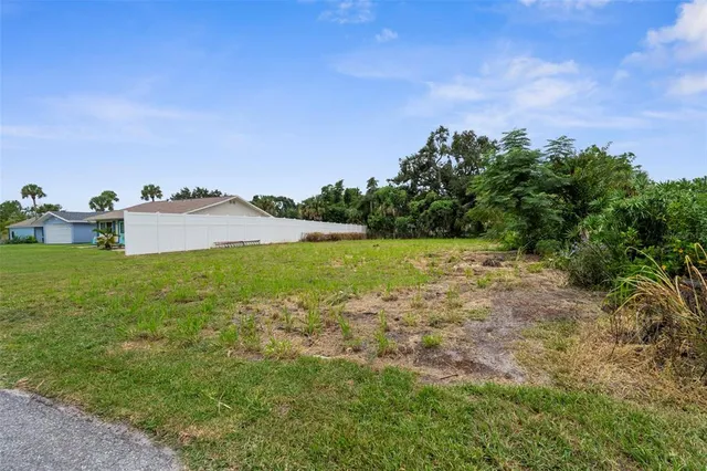 a view of a lake with a yard
