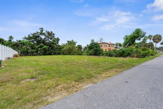 a view of a field with an ocean view