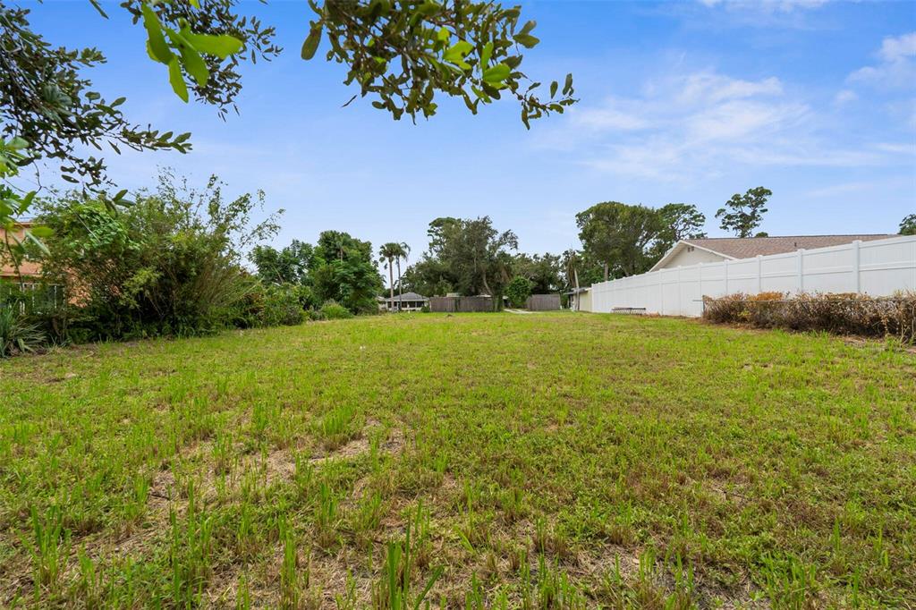 216 Pavonia Road Nokomis, FL 34275 - Photo 10 of 12 a view of a yard with an outdoor space