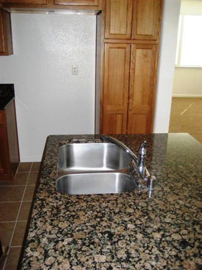 392 Abbott Court Reedley, CA 93654 - Photo 3 of 7 Granite Countertops in kitchen **Picture may not be of this home. Pictures are of a home of the same model**