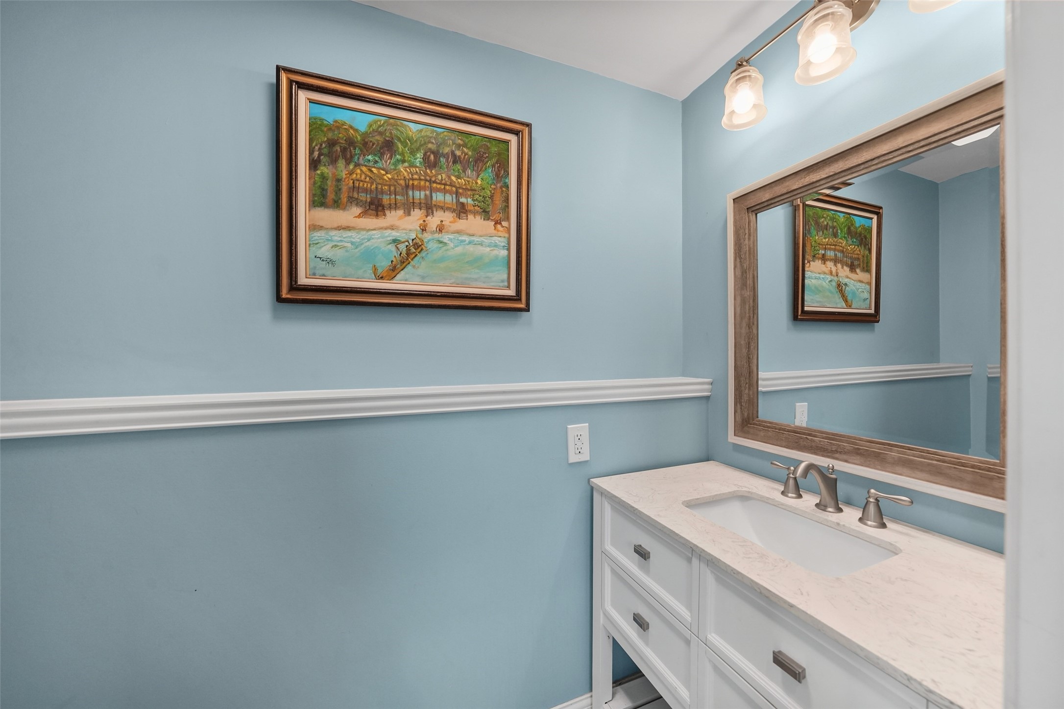 26534 Mitchell Road Hempstead, TX 77445 - Photo 30 of 45 a bathroom with a granite countertop sink a mirror and a picture on the wall