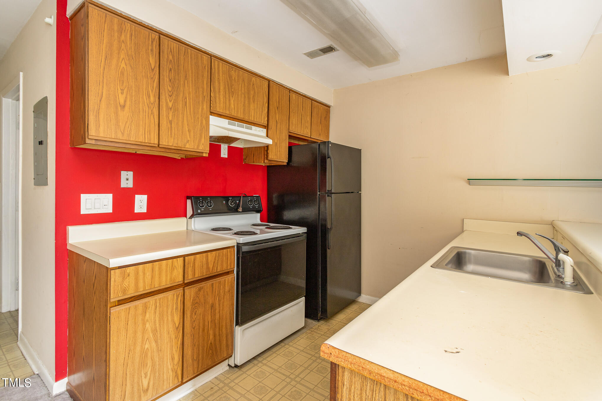 3051 Huntleigh Drive Raleigh, NC 27604 - Photo 5 of 16 a kitchen that has a sink and a refrigerator