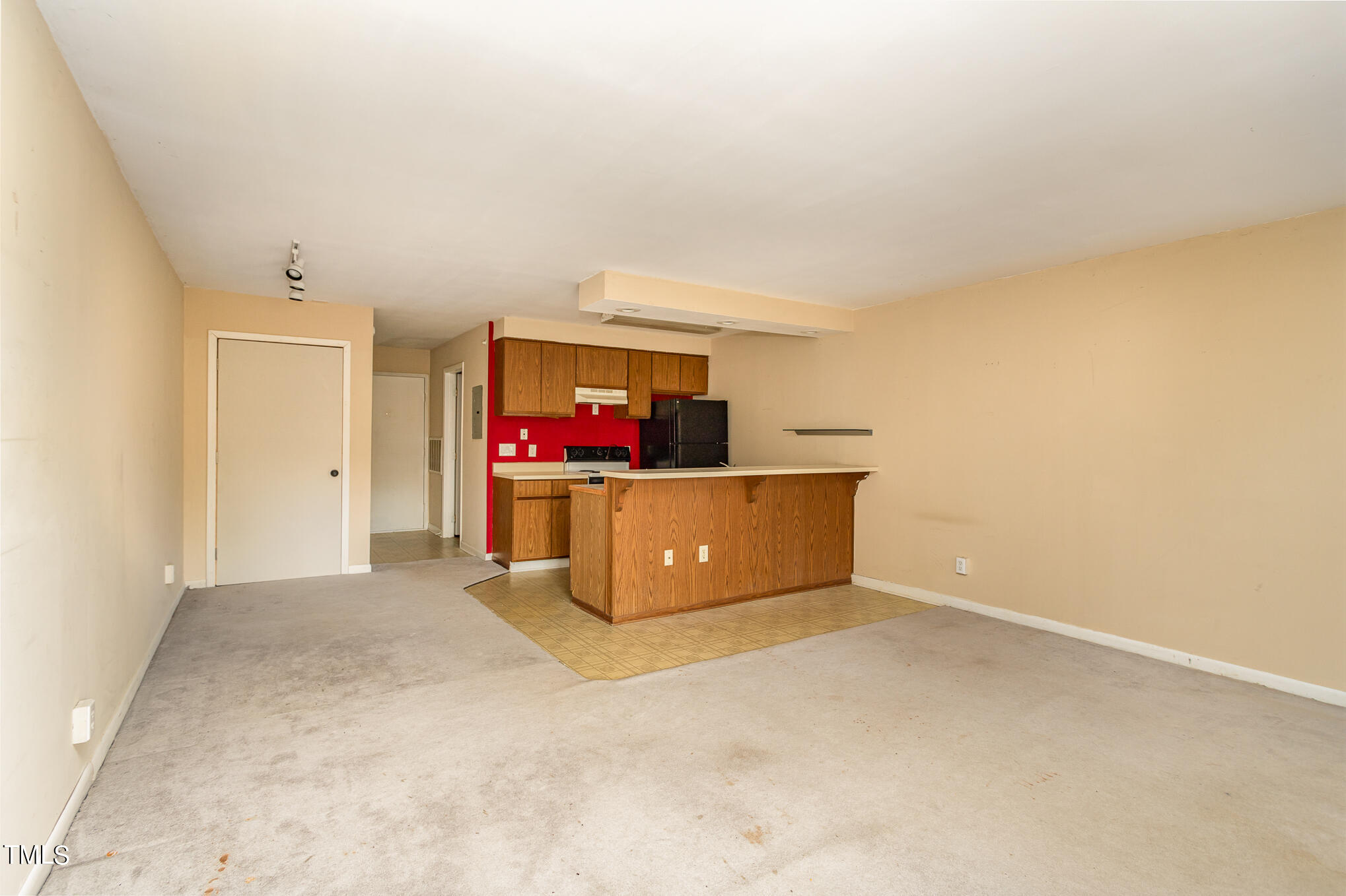 3051 Huntleigh Drive Raleigh, NC 27604 - Photo 6 of 16 a living room with a couch and a flat screen tv