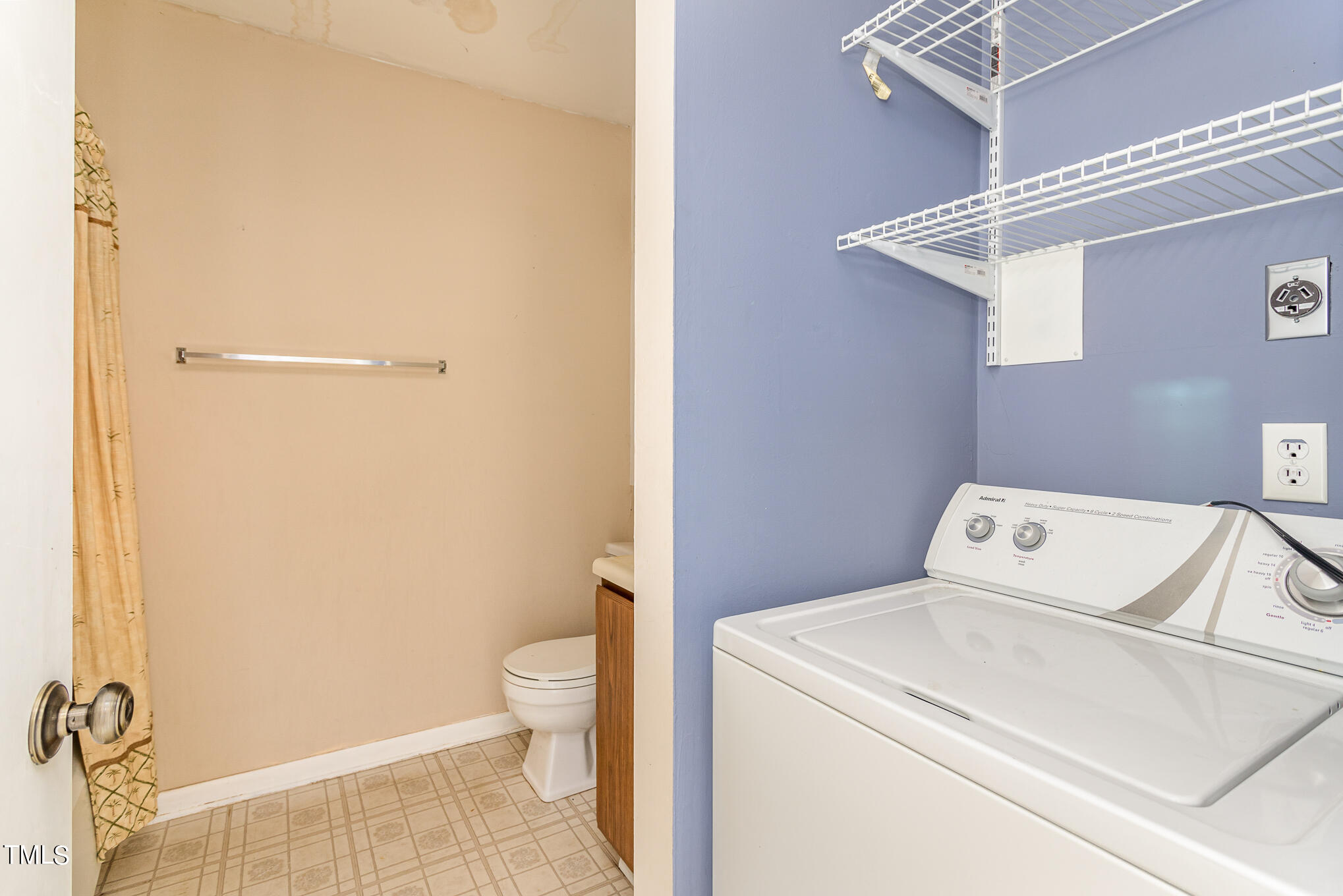 3051 Huntleigh Drive Raleigh, NC 27604 - Photo 8 of 16 a view of bathroom with a washer and dryer