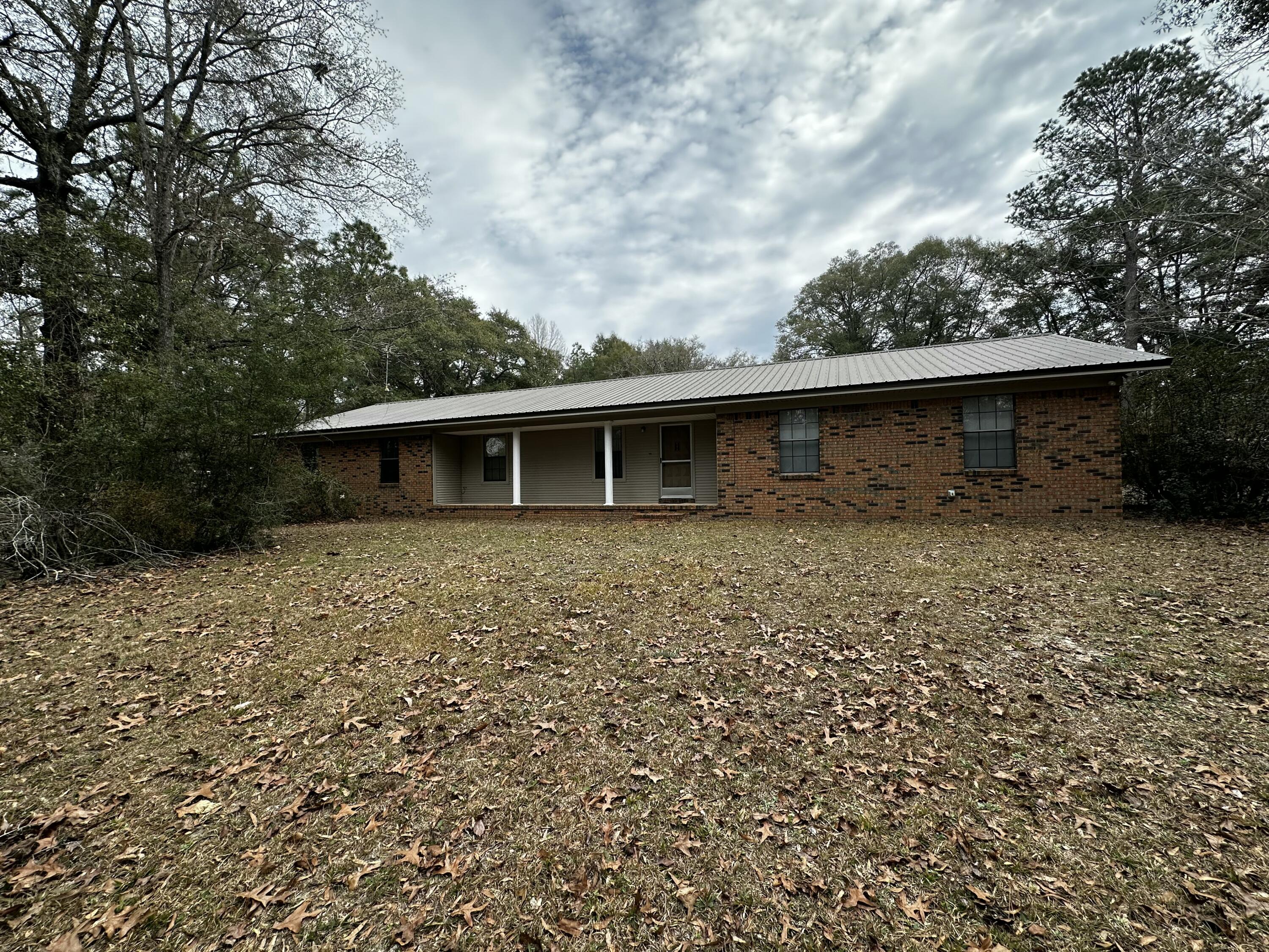 5895 Pineforest Drive Crestview, FL 32539 - Photo 13 of 23 a front view of house with yard