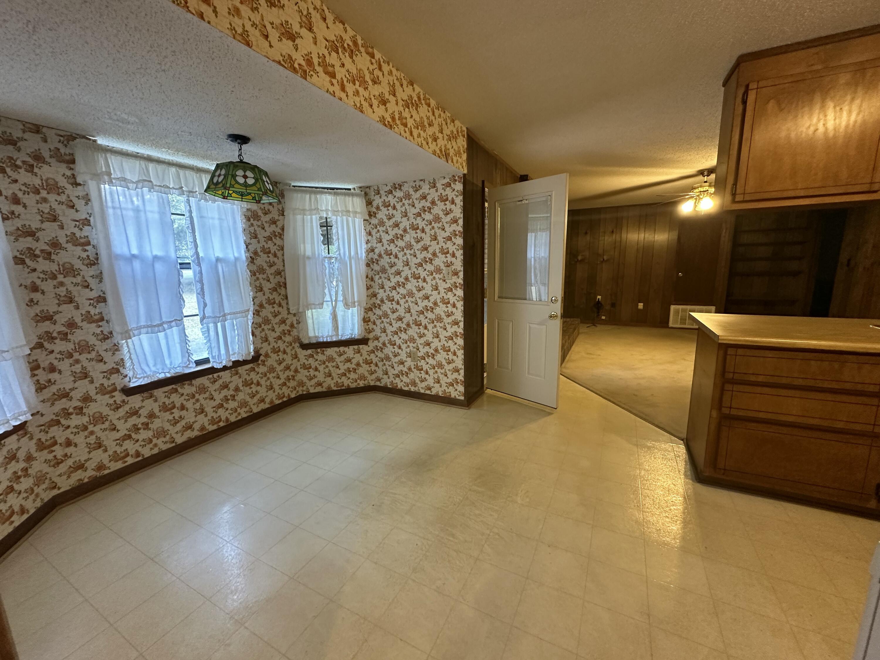 5895 Pineforest Drive Crestview, FL 32539 - Photo 19 of 23 a view of a livingroom with furniture and bathroom