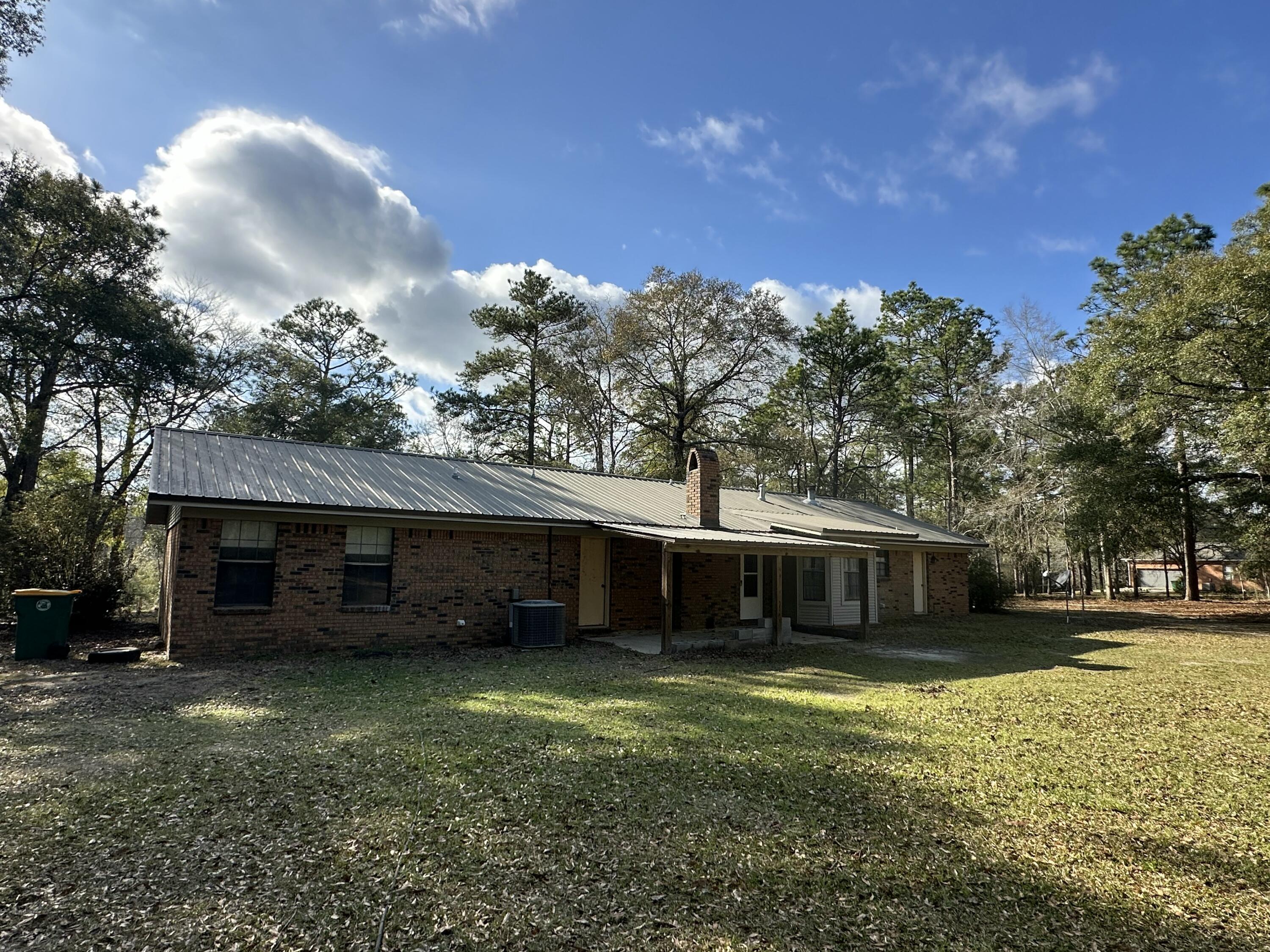 5895 Pineforest Drive Crestview, FL 32539 - Photo 2 of 23 a view of a house with a yard