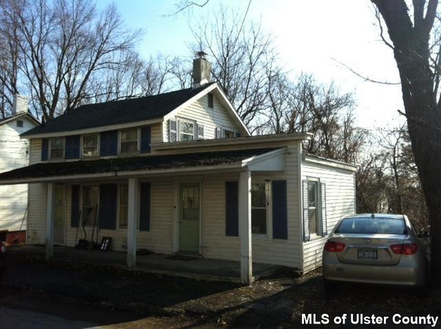 a house with trees in the background