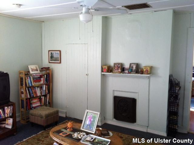 22 Post Street Saugerties, NY 12477 - Photo 6 of 14 a living room with furniture and a fireplace