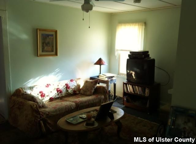 22 Post Street Saugerties, NY 12477 - Photo 7 of 14 a living room with furniture and a window