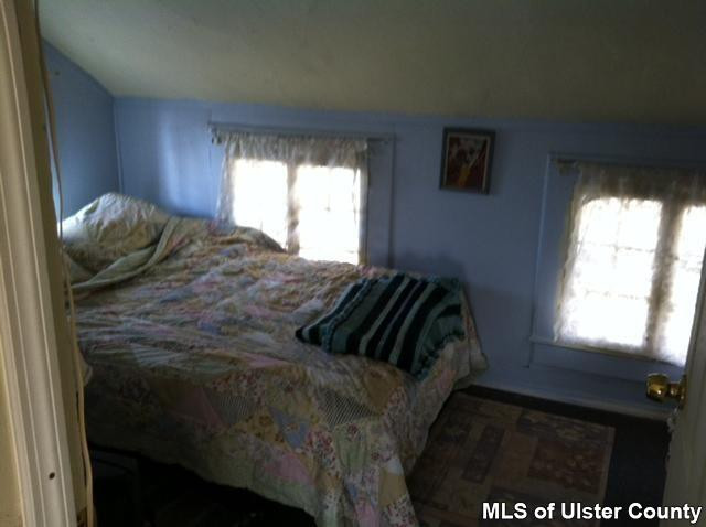 22 Post Street Saugerties, NY 12477 - Photo 9 of 14 a bedroom with a bed and window