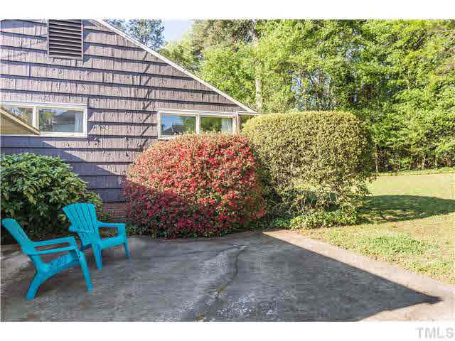 829 Bryan Street Raleigh, NC 27605 - Photo 17 of 23 a view of a chairs and table in the backyard of the house