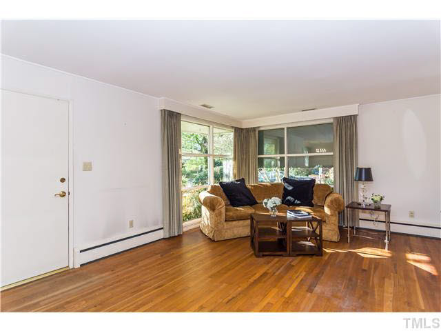829 Bryan Street Raleigh, NC 27605 - Photo 3 of 23 a living room with furniture and a wooden floor