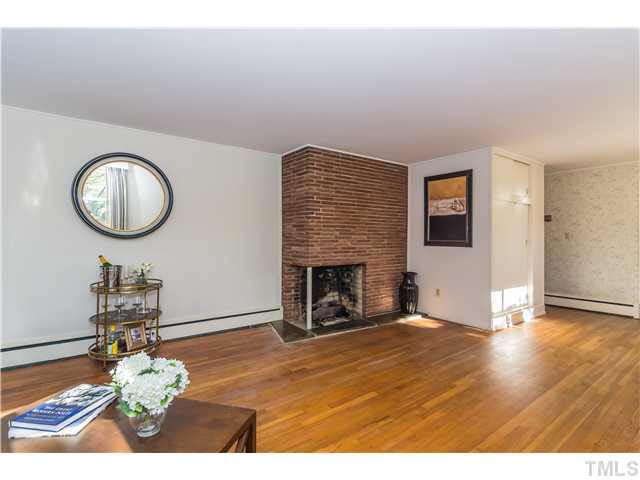 829 Bryan Street Raleigh, NC 27605 - Photo 5 of 23 a view of a livingroom with furniture a fireplace
